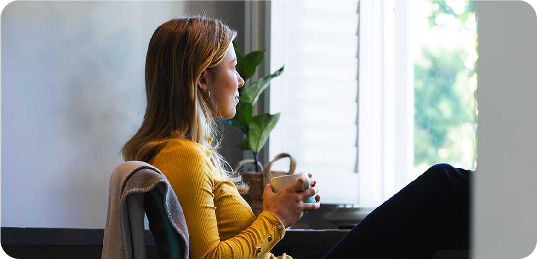 Woman Looking Out Window